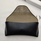 Black leather glasses case with magnetic closure